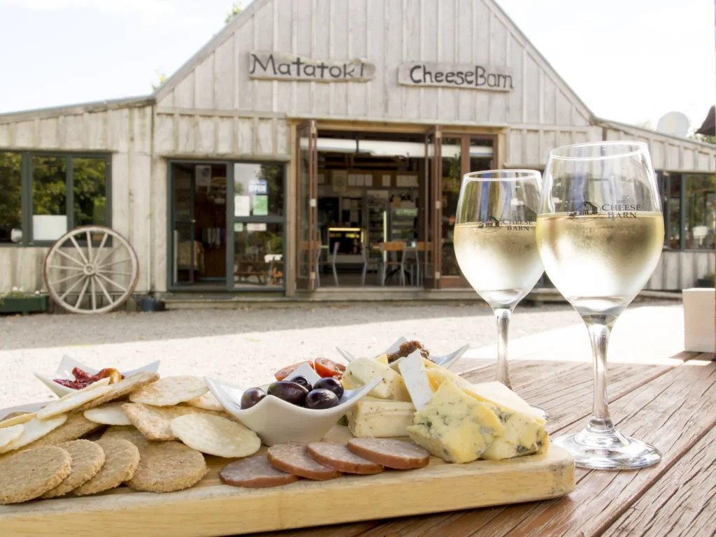 The Cheese Barn café at Matatoki, with a cheese board and wine on the deck